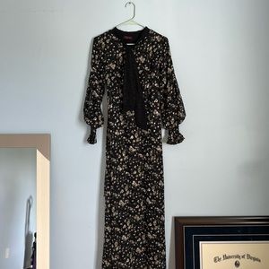 NWOT floor length floral dress with a black bow neckline